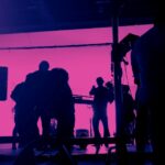 Video Production Insights by Doleep Studios 7 | video production costs A team of professionals brainstorming ideas for a successful corporate video production process