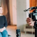 A professional setting with a camera crew capturing an interview for video content creation