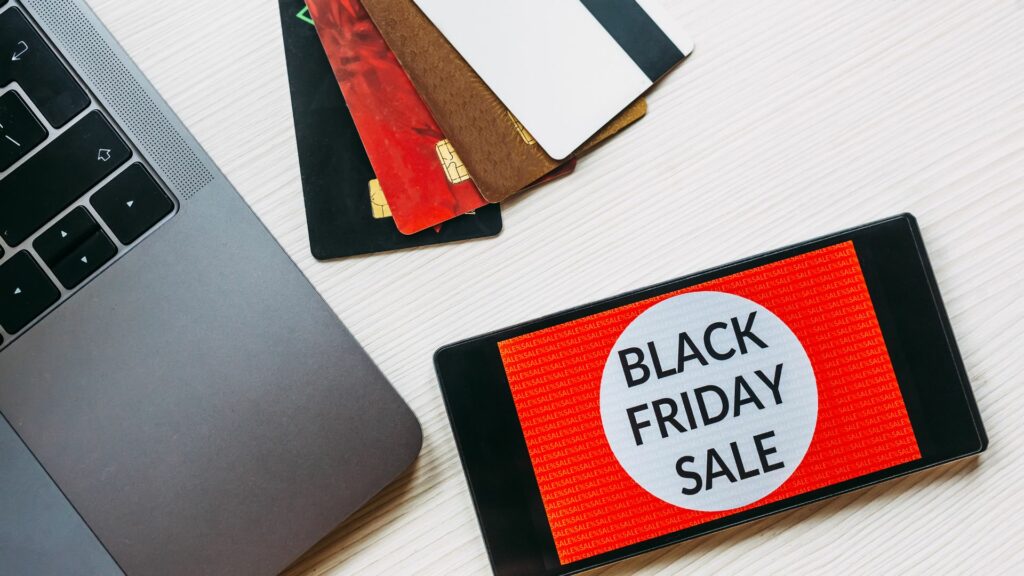 A phone displaying a video with a Black Friday Sale Ad promoting "Mobile Video Ads: Capture the Dubai Market with Doleep Studios.