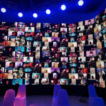 An image of a webinar displayed on a screen, representing the impact of webinar production in engaging the UAE audience.
