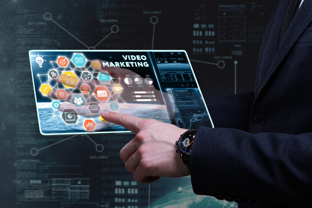 Close-up of a laptop screen displaying a marketing video with focus keyword "Marketing Videos