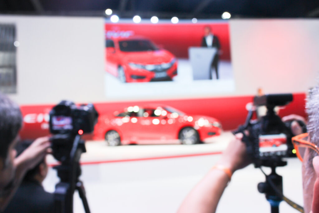 A dynamic image capturing the product launch of a car, showcasing the impact of a strategic product launch video.