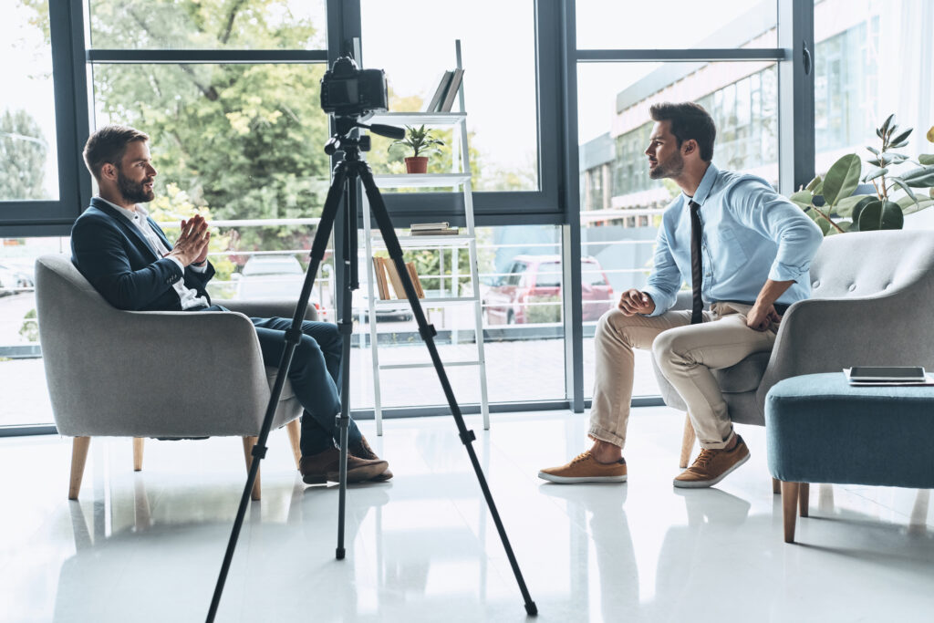 Two business professionals engaged in a corporate interview, representing the essence of Q&A Videos