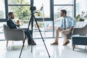 Two business professionals engaged in a corporate interview, representing the essence of Q&A Videos